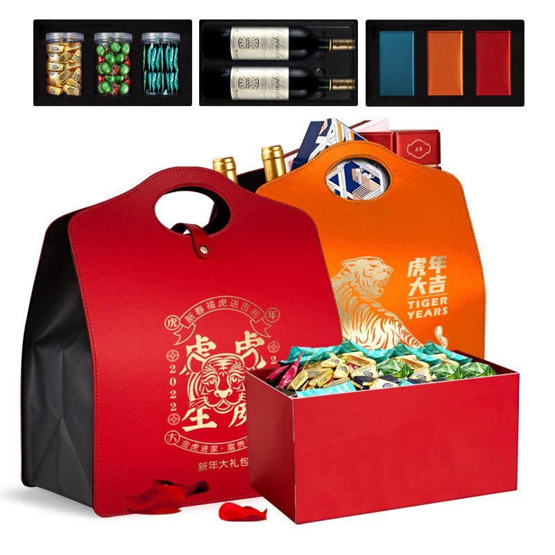 Red and orange festive gift boxes open with sweets inside